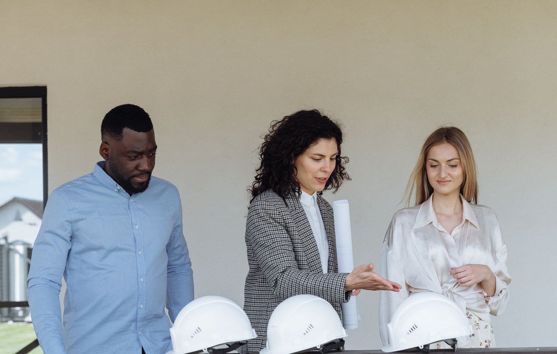 An Estatic team reviewing plans on site