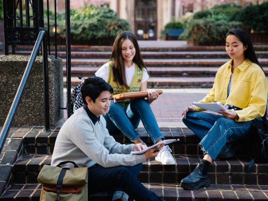 Students studying together on the campus steps