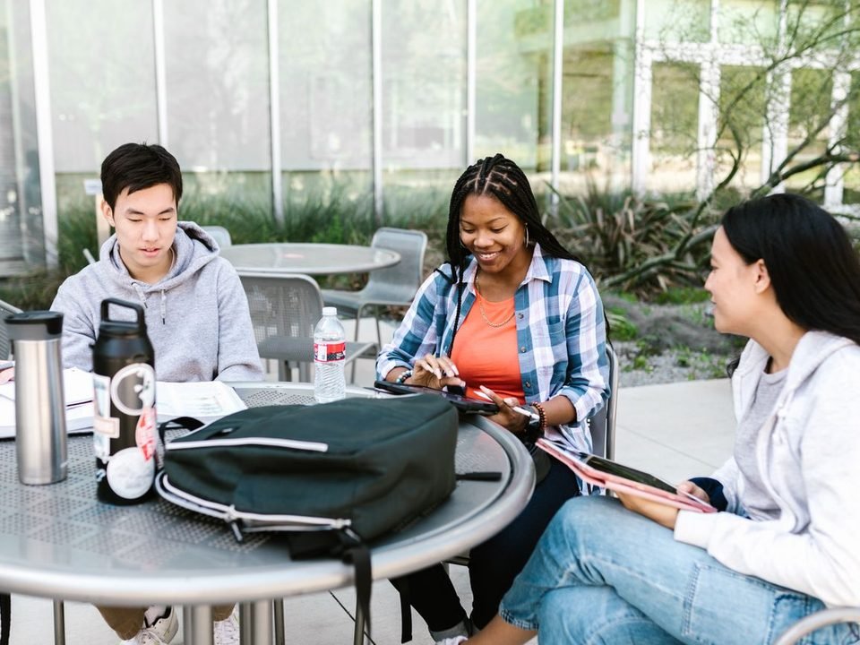 An admissions conversation at a campus table